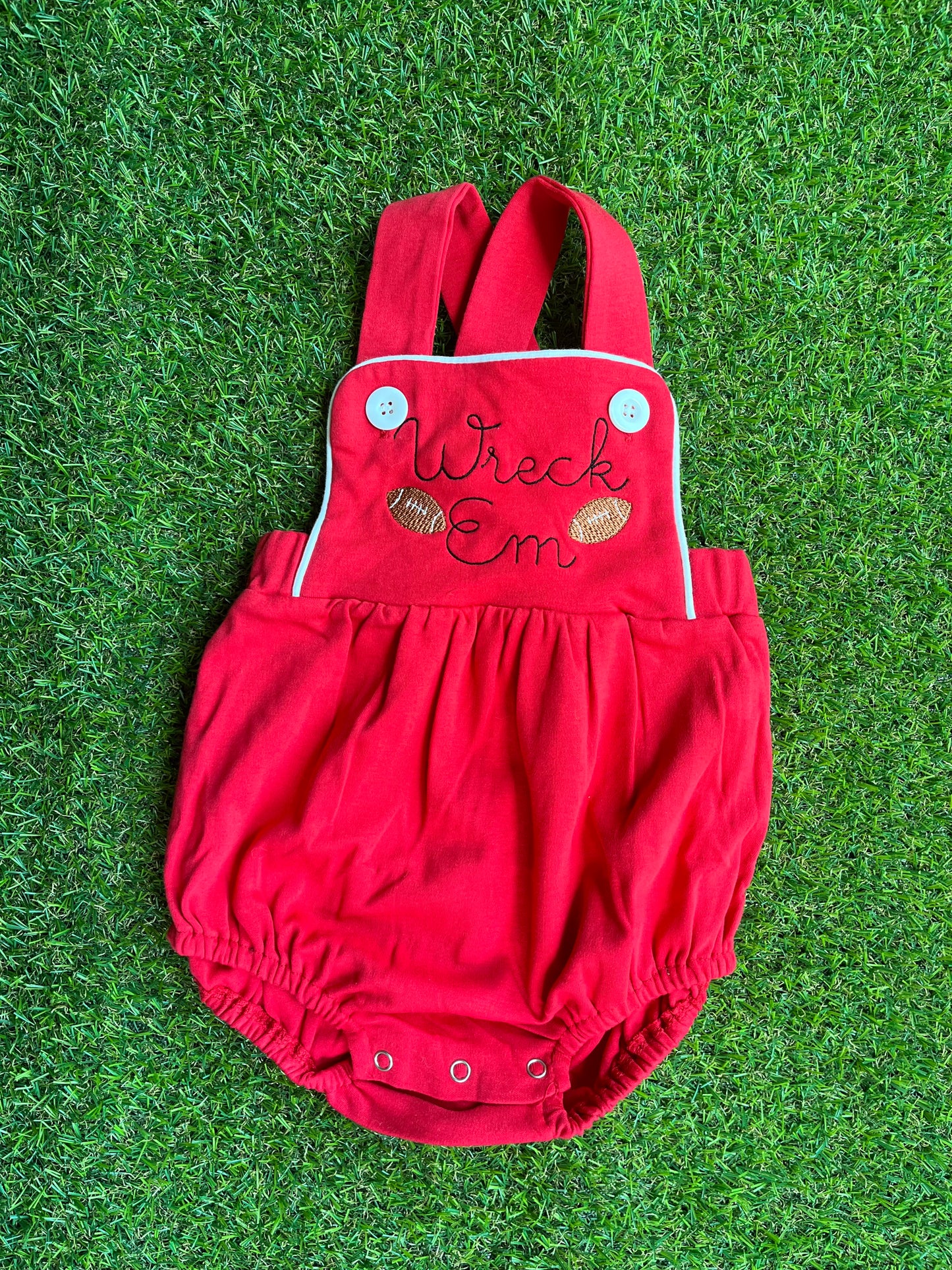 Baby sun suit "Wreck 'Em" with footballs